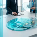 Conceptual photo of a semiconductor wafer featuring Apple and Intel logos on a corporate meeting table
